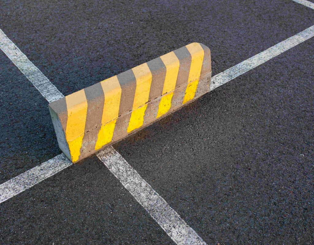 Parking Stop Barrier on Marked Asphalt